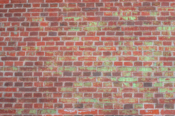 Red brick wall background. Brickwork with deposits on it. The texture of a stone wall.