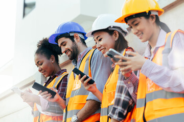 A portrait of an industrial group engineer with smartphone in a factory, working.