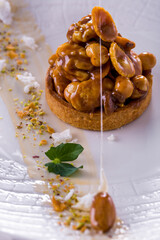 Dessert tart with nuts in caramel
