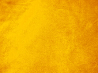 Yellow old velvet fabric texture used as background. Empty golden fabric background of soft and smooth textile material. There is space for text..