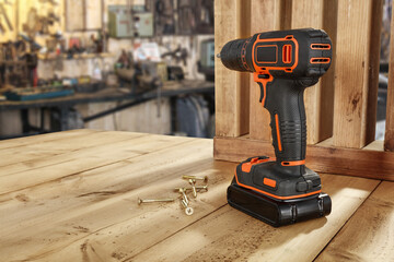 Black and orange drill and workshop interior. 