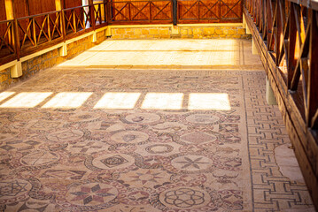 Ancient Greek floor mosaic in archaeologic park Kato Paphos, Cyprus.