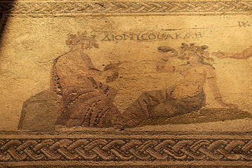 Ancient Greek floor mosaic in archaeologic park Kato Paphos, Cyprus.