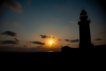 Beautiful sunset at the lighthouse of Kato Paphos coastline.