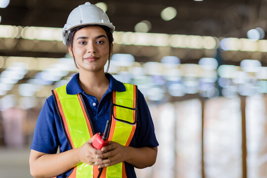 Portrait Indian Woman Worker Supervisor With Engineer Safety Suit Work In Large Factory Warehouse