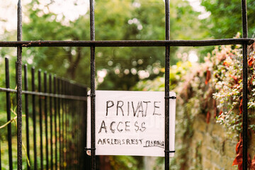 Ad hoc Private Access Sign seen attached to a wrought iron gate for access to a private fishing...