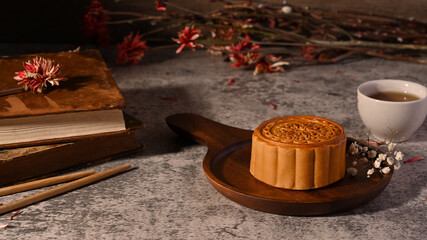 Delicious traditional moon cake on stone table. Chinese Mid Autumn festival celebration