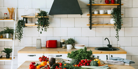 banner background of fresh vegetables for salad on wooden table, peppers, tomatoes, cucumbers, broccoli and greens in cozy kitchen apartment