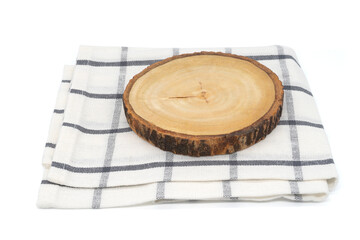 Wooden slice natural round coaster with cloth isolated on white background. Mock up. Selective focus.