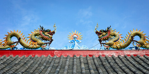 detail of the roof  of chinese temple with dragon