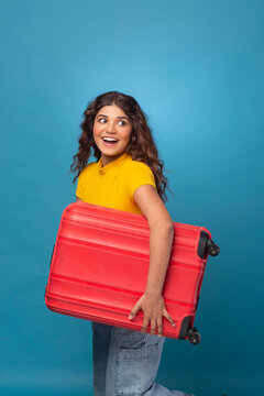 Beautiful young woman with suitcase/luggage
