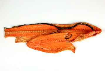 Hot smoked salmon trim and leftovers with bones and fins on white background.