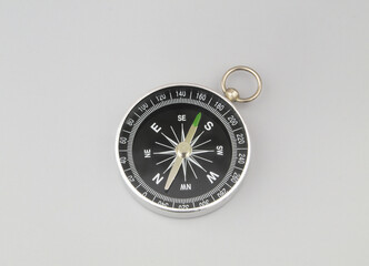 Compass on grey background. Find destination, travel and navigation concept.