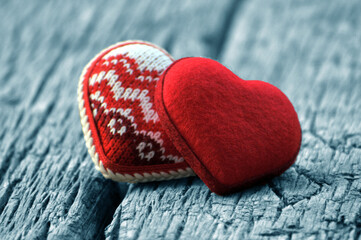 Fototapeta premium Valentines Day Background Two Red Hearts On Wooden Table