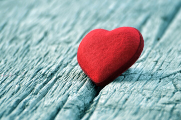 Fototapeta premium Valentines Day Background Two Red Hearts On Wooden Table