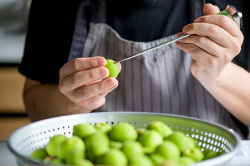 Making Japanese apricot syrup and liqueur.
Ume Shigoto,Japanese plum preparation.