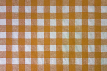 Orange and white classic checkered tablecloth texture