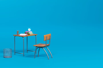 School desk with school accessory on the table on blue background 3D Rendering