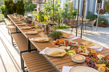 Food served outdoor on a long table - Powered by Adobe