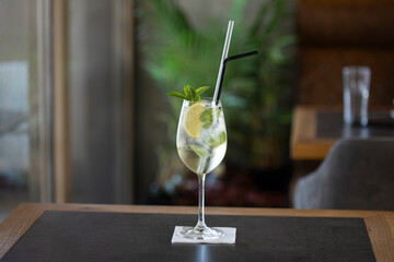 Mojito cocktail served in a glass with straws