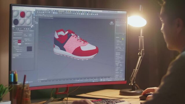 Over The Shoulder View Of Male Footwear Designer Rotate 3D Model Of Shoe And Change Colours On It While Working On A Desktop At Home. Shoe Production Procedure Concept&nbsp;
