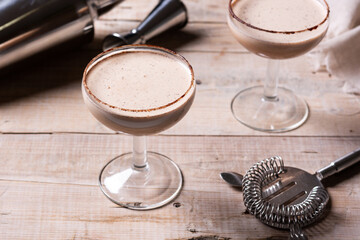 Brandy Alexander cocktail on wooden table	