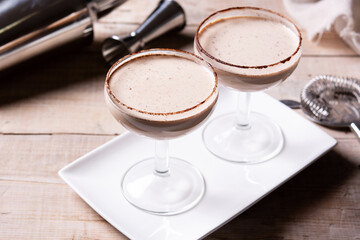 Brandy Alexander cocktail on wooden table	