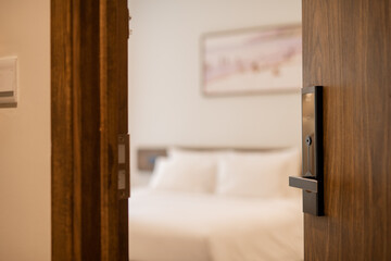 Digital door lock on modern wooden door for protection and safety for home.