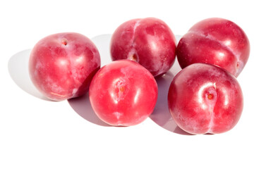 Ripe juicy tasty cherries and apricots lie on the kitchen round board.