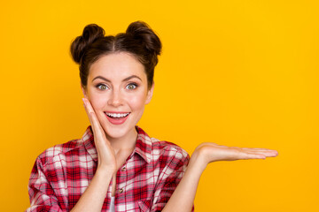 Photo of positive shocked lady hold arms impressed incredible promo discounts isolated vivid color background