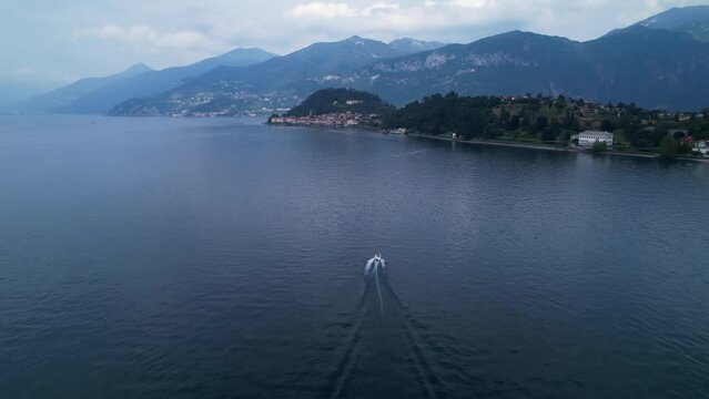 Boat on lake como Italy - speedboat from drone