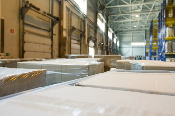 Group of boxes in storehouse. Pallets with carton boxes. Interior of a modern warehouse storage