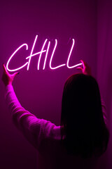 Beautiful girl with neon signs. Pink neon sign chill. Trendy style. Neon sign. Custom neon. Home...