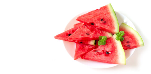 Juicy fresh nutritious watermelon on a plate with mint leaves on top, healthy eating habit