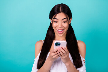 Photo of surprised millennial lady blogging network gadget web sale isolated on aquamarine color background