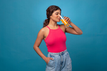 Healthy young woman with glass of fruit juice