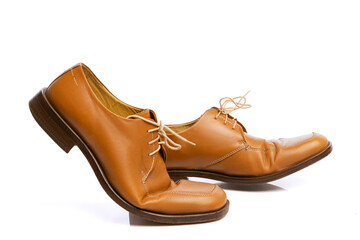 Male brown classic style shoes over white background. Vintage dress shoes. Concept of ad, sales , fashion, retro vintage style