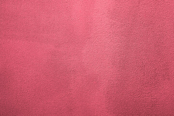 The crimson texture of a cement screed wall background