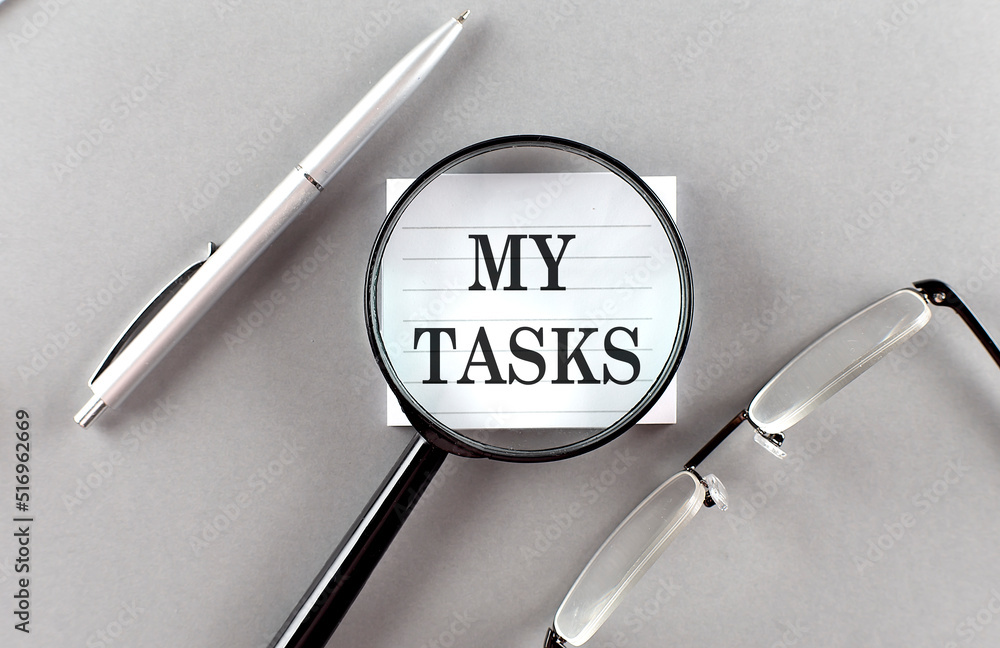 Poster word my tasks on sticky through magnifier on grey background