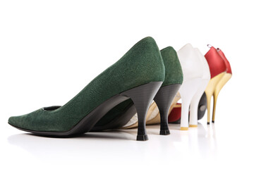 Back view of three pairs of woman's vintage style footwear. High-heeled shoes isolated on white background. Concept of art, ad , 60s, 70s retro style fashion. Timeless classic