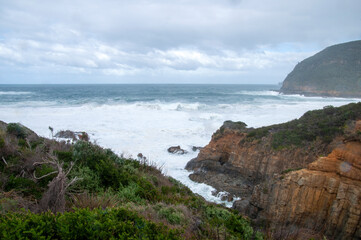 Maingon Bay Australia, view of waves breaking along coastline and channel into the Remarkable cave