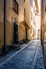 Fototapeta na wymiar Old cobbled street of Stockholm