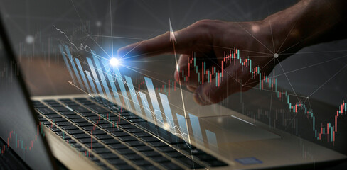 finger on laptop finance trading banner