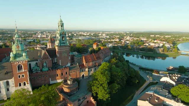 Aerial view of Wawel royal Castle and Vistula river early morning. Panorama of the city is visible in the background. Krakow, Poland.