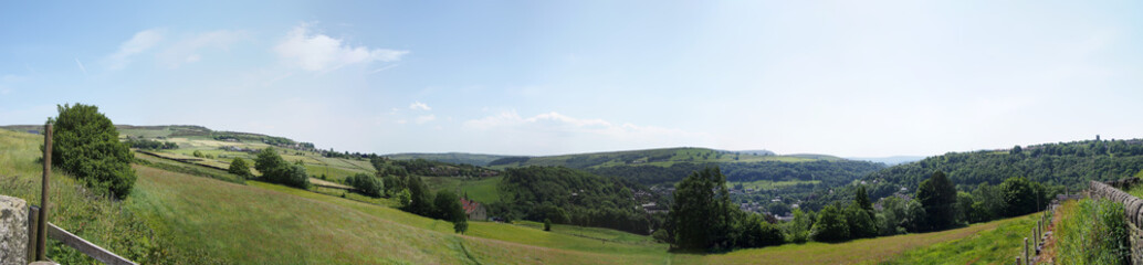 Naklejka premium long panoramic view of the calder valley in west yorkshire with hebden bridge and heptonstall visible in the distance