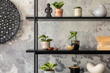 The stylish composition of wabi sabi interior with black rack with  personal accesoories. Grey concrete wall. Home decor. Template.