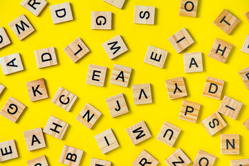 The concept of developing thinking, grammar, back to school, learning. Top view of square wooden...