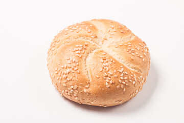 Fresh bread with seeds on a white table background. Bakery. Food security concept. 