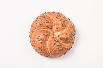 Fresh bread with seeds on a white table background. Bakery. Food security concept. 