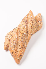 Fresh bread with seeds on a white table background. Bakery. Food security concept. 